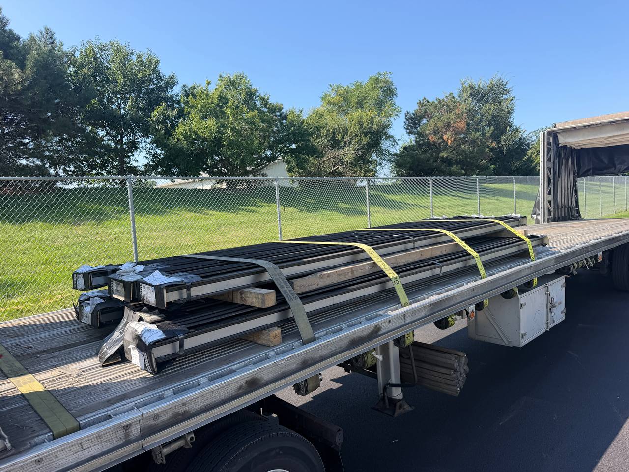 Bundles of steel beams strapped on a flatbed